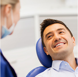 Dental hygienist speaking with a patient